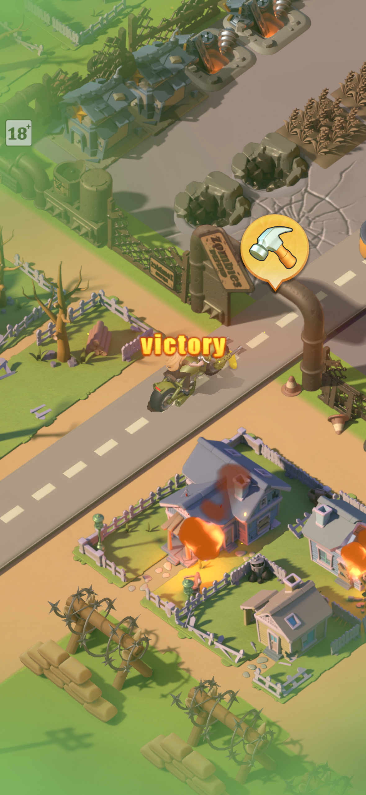 The aftermath of a successful attack: "victory" floats in yellow above the road as a motorcycle scout returns. To the right, the conquered settlement burns — roof on fire, structures flickering orange. Dead and scorched trees line the background. This is what winning looks like in Last War: not a clean trophy screen, but a smoldering proof of force. The burning buildings are a countdown — the defender will repair, regroup, and the territory will be contested again.